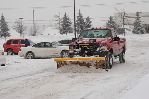 red snow plow truck