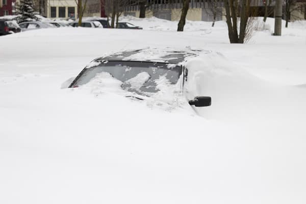 snow buried car