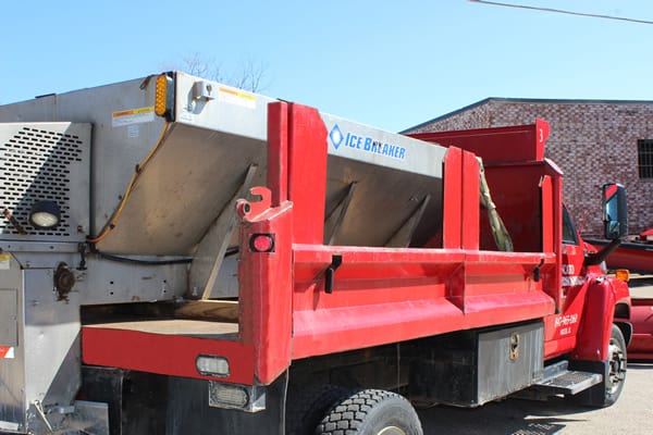 Salt or sand spreader on truck