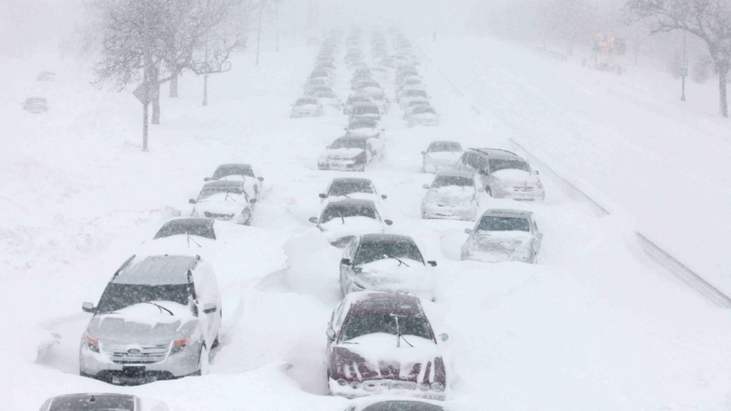 cars on lake shore drive prior to snow plowing